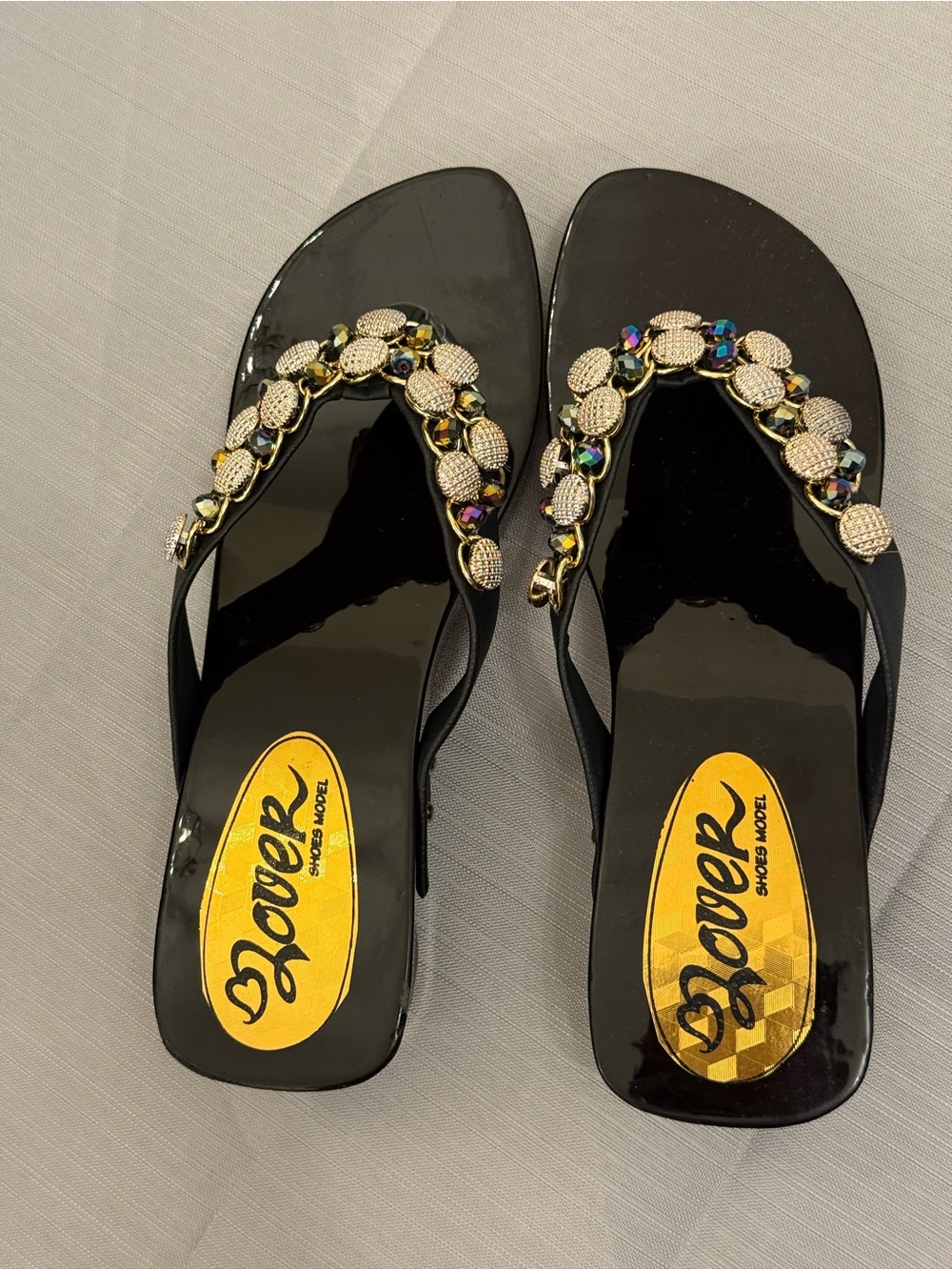 Black Jeweled Patent Flip Sandals featuring a glossy finish , size 7.5